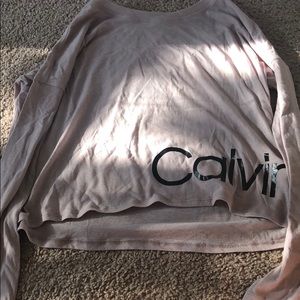 A light pink Calvin Klein long sleeve shirt